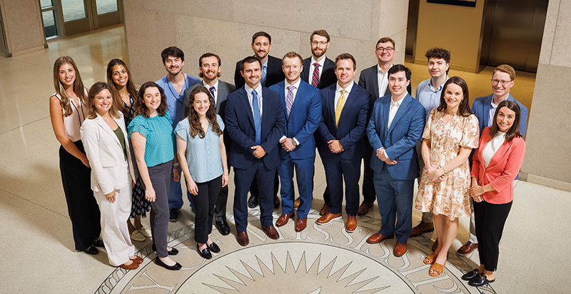 Group portrait of 18 members of the Department of Ophthalmology in the lobby of the School of Medicine.